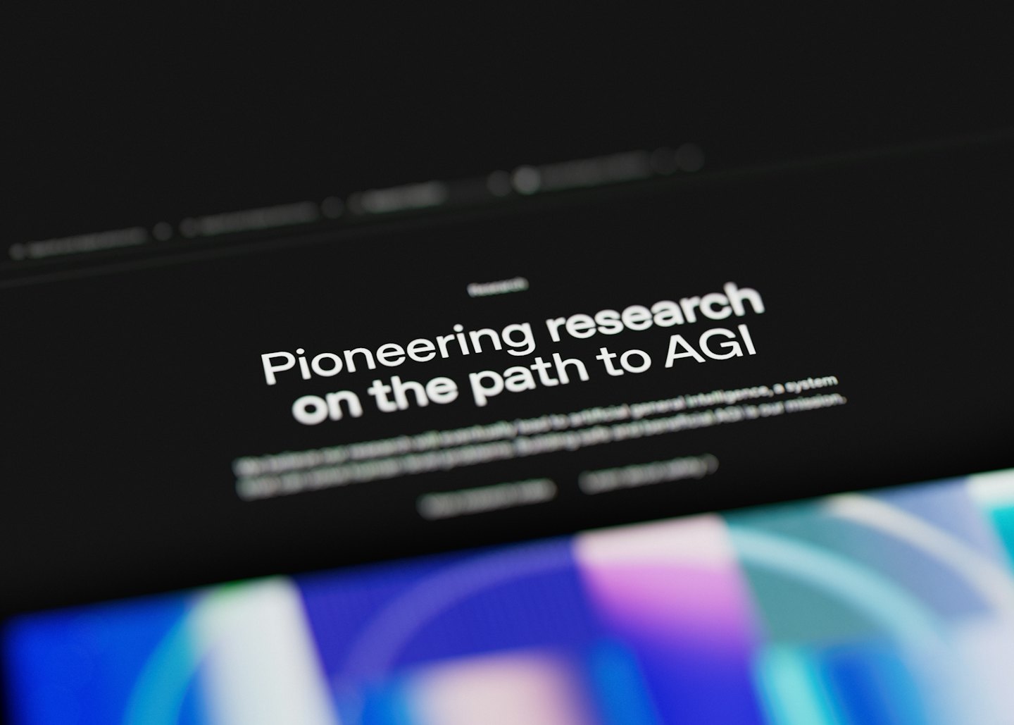 Digital screen displaying text about artificial general intelligence research.